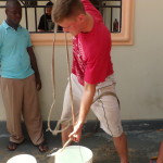 Micah, drawing water from a neighbors cistern.